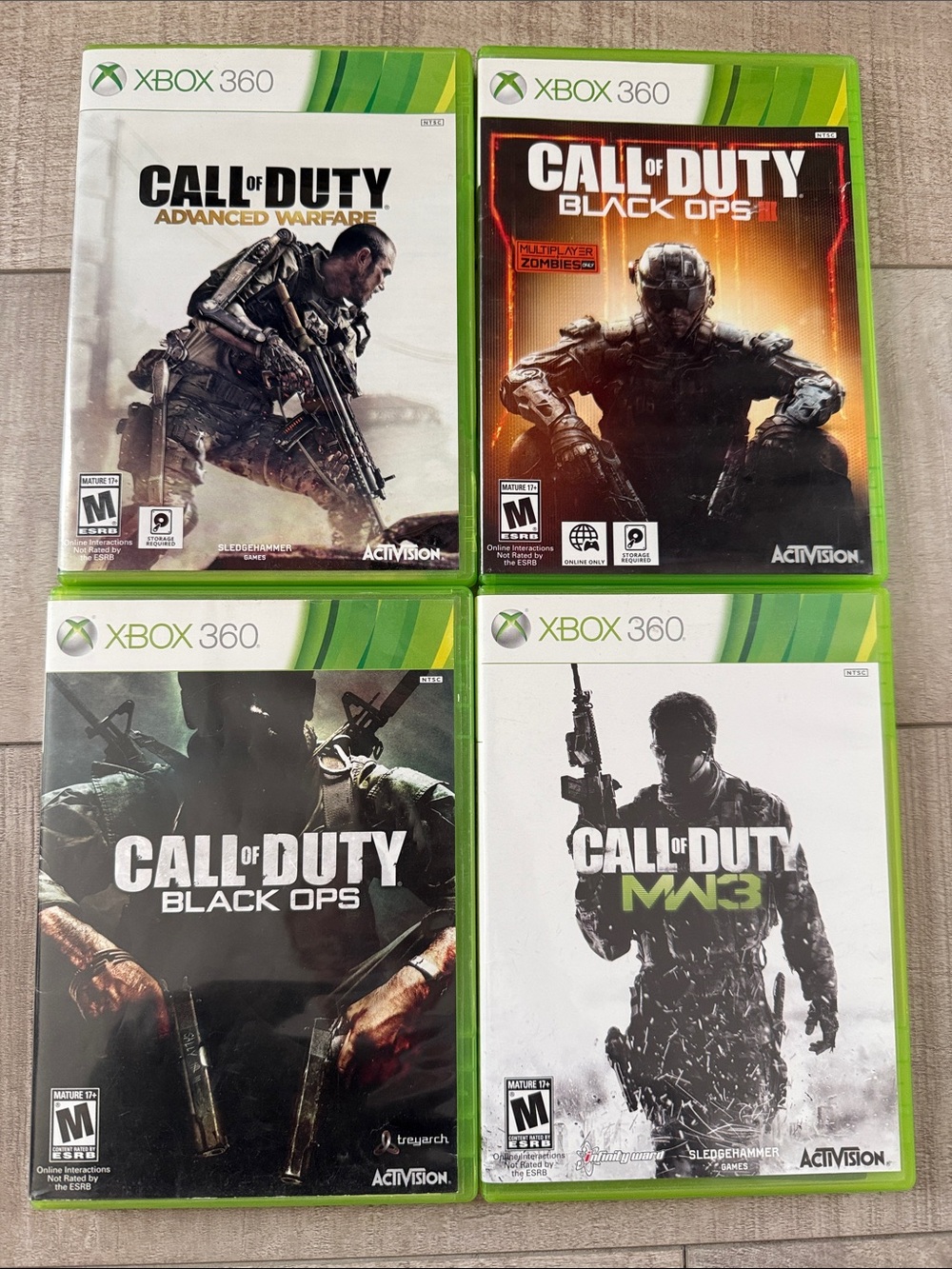 Microsoft Xbox 360 Call of Duty Game Bundle - Black, White, Orange, Green Covers
